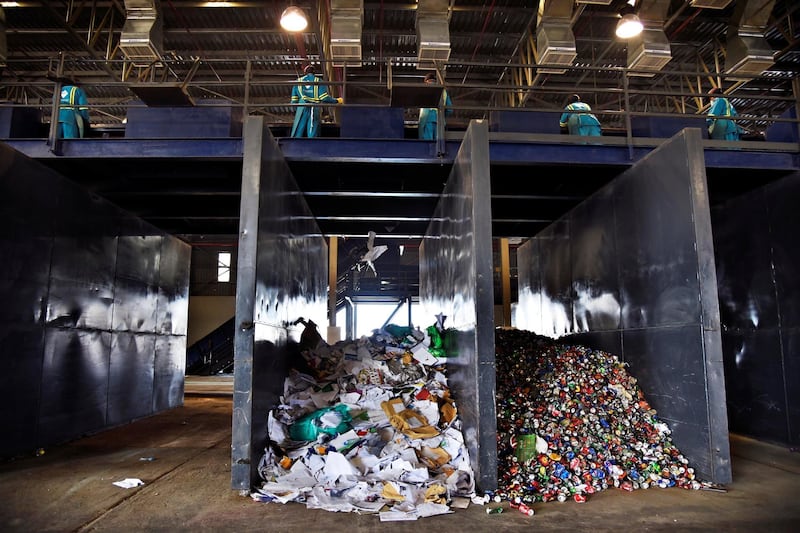 Workers at the Material Recovery Facility sort through garbage during its opening ceremony in Ras Al Khaimah, UAE, Wednesday, Nov. 27, 2019. Shruti Jain The National