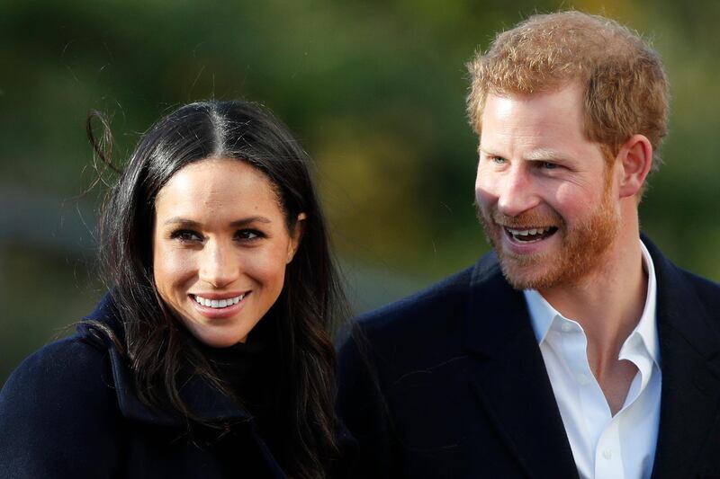 FILE - In this Dec. 1, 2017 file photo, Britain's Prince Harry and his fiancee Meghan Markle arrive at Nottingham Academy in Nottingham, England. Prince Harry's fiancee is set to join Britain's royal family for Christmas. Kensington Palace says Meghan Markle will join Queen Elizabeth II and other senior royals at Sandringham, a sprawling estate in Norfolk, 110 miles (175 kilometers) north of London, it was announced on Wednesday, Dec. 13, 2017.  (AP Photo/Frank Augstein, File)