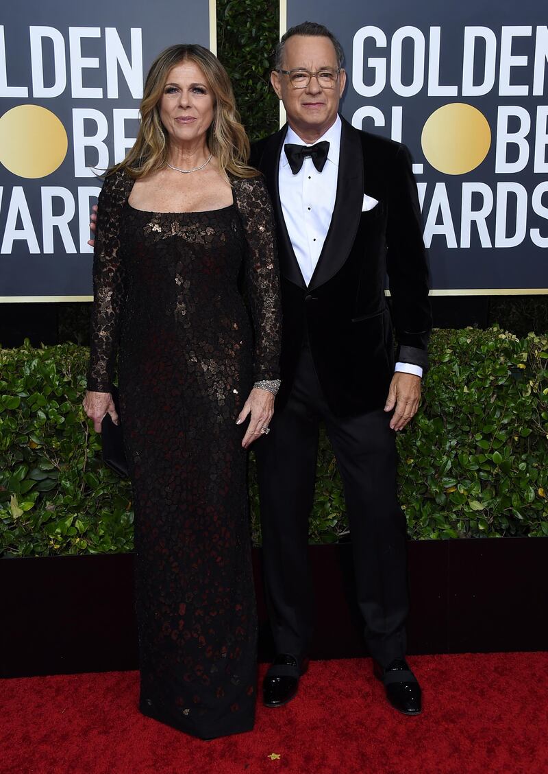 Rita Wilson, left, and Tom Hanks, wearing Tom Ford, arrive at the 77th annual Golden Globe Awards at the Beverly Hilton Hotel on January 5, 2020. AP