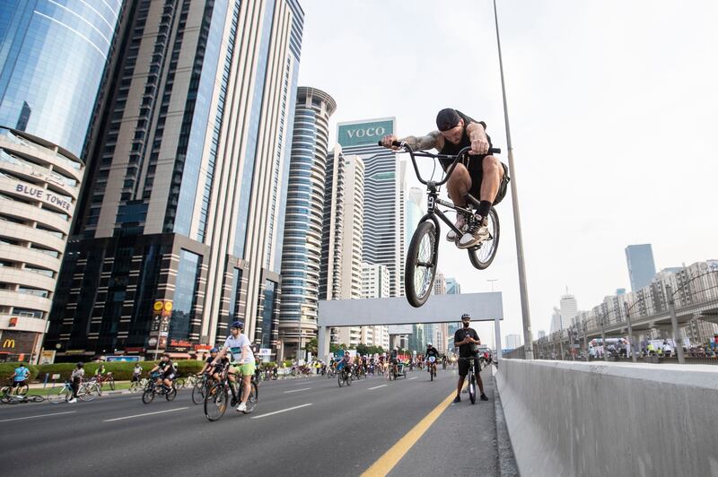 A cyclist performs a stunt along Sheikh Zayed Road. 