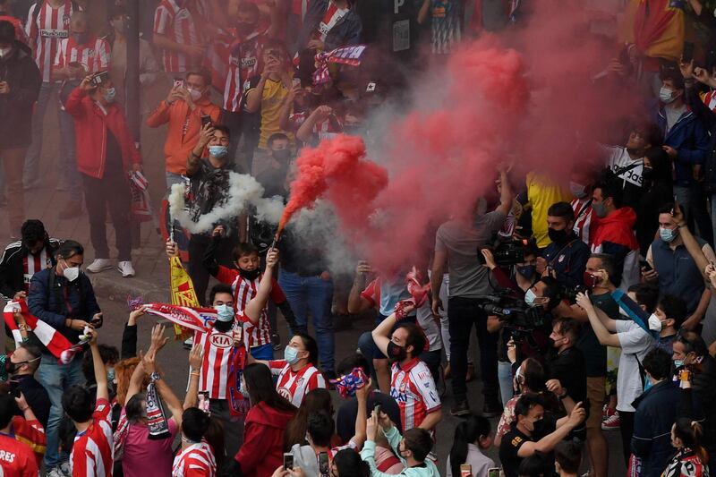 Supporters light flares after Atletico Madrid's La Liga win. AFP