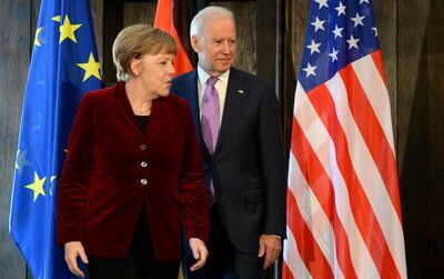 In this file photo taken on February 7, 2015, Angela Merkel and Joe Biden meet before trilateral talks during the 51st Munich Security Conference. AFP