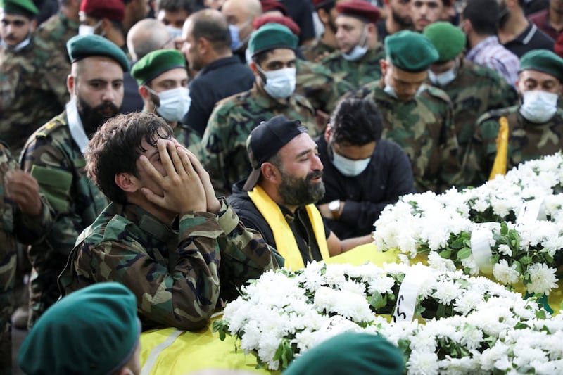 Supporters of Lebanon's Hezbollah attend a funeral in Beirut's southern suburbs. The group accused the Christian Lebanese Forces party of carrying out the Beirut attacks. Reuters