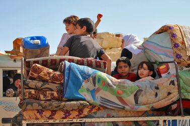 Syrian child refugees return home from Lebanon. AFP