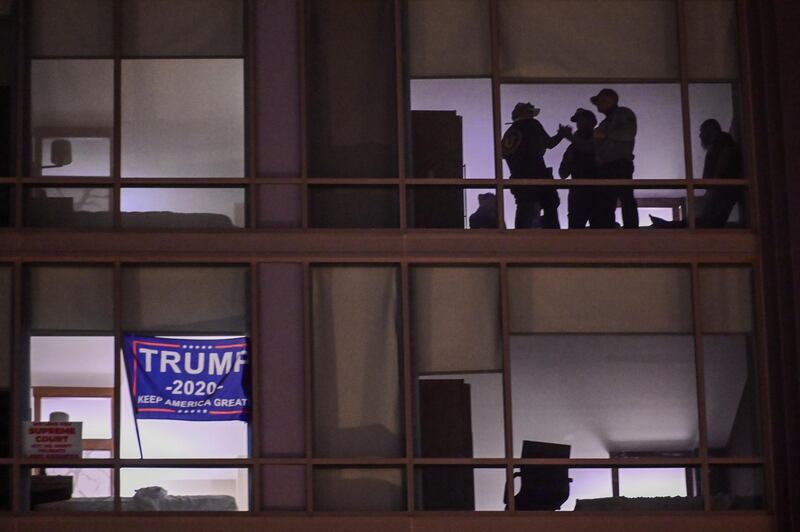 Members of the the far-right group Proud Boys are seen in a room of the Hyatt Place hotel near Black Lives Matter Plaza in Washington, US. Reuters