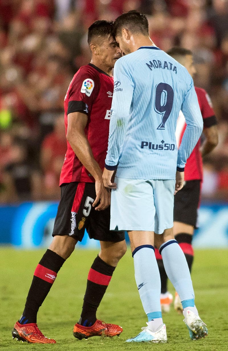 Atletico Madrid's Spanish forward Alvaro Morata quarrels with Mallorca's spanish defender Xisco Campos. AFP