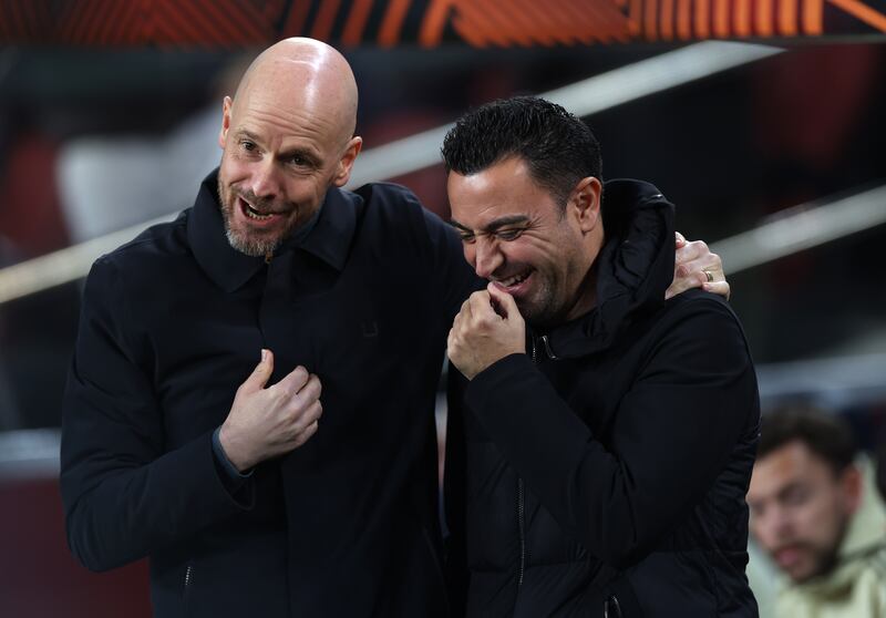 Manchester United manager Erik ten Hag and Barcelona's   Xavi before the game starts at  Camp Nou. PA