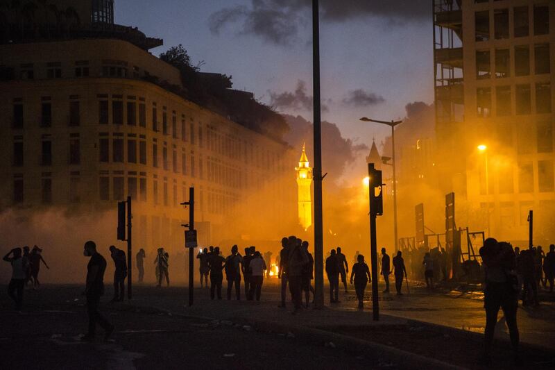 A cloud of tear gas drifts through a crowd of protesters during a protest at Martyrs Square. Getty Images