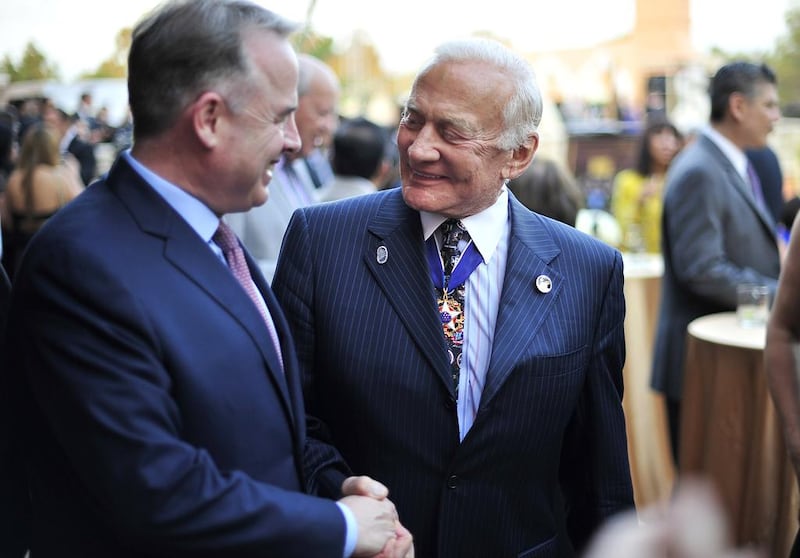 James Hogan, the president and chief Executive of Etihad Airways, left, and astronaut Buzz Aldrin attend a gala to celebrate the launch of Etihad’s non-stop service between Los Angeles and Abu Dhabi. Jerod Harris / Getty Images for Etihad Airways / AFP