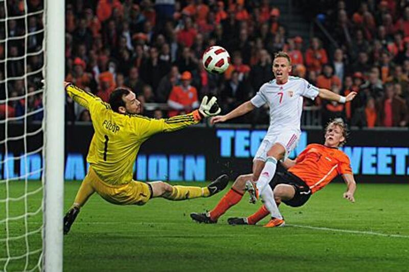 Dirk Kuyt, in orange, shoots and scores in Holland's 5-3 victory against Hungary.