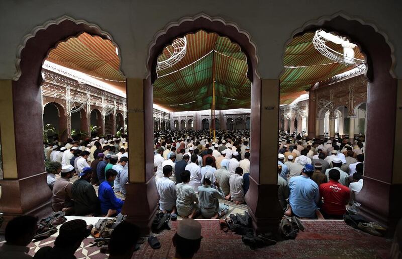 Pakistani residents offer Friday prayers at a mosque during the first Friday of Ramadan in Peshawar. Abdul Majeed / AFP