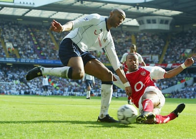LONDON - APRIL 25:  Frederic Kanoute of Spurs clashes with Ashley Cole of Arsenal during the FA Barclaycard Premiership match between Tottenham Hotspur and Arsenal at White Hart Lane on April 25, 2004 in London.  (Photo by Ben Radford/Getty Images)