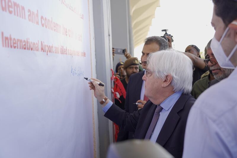 UN Special Envoy for Yemen Martin Griffiths signs on a board upon arrival at Aden Airport, Aden. EPA