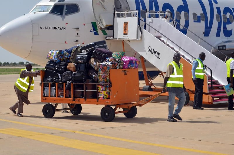 Ground crew unload luggage from a flight. Many airports around the world, not just Sharm El Sheikh and Egypt, remain vulnerable to threats from staff, who have until now gone largely without adequate screening. AFP