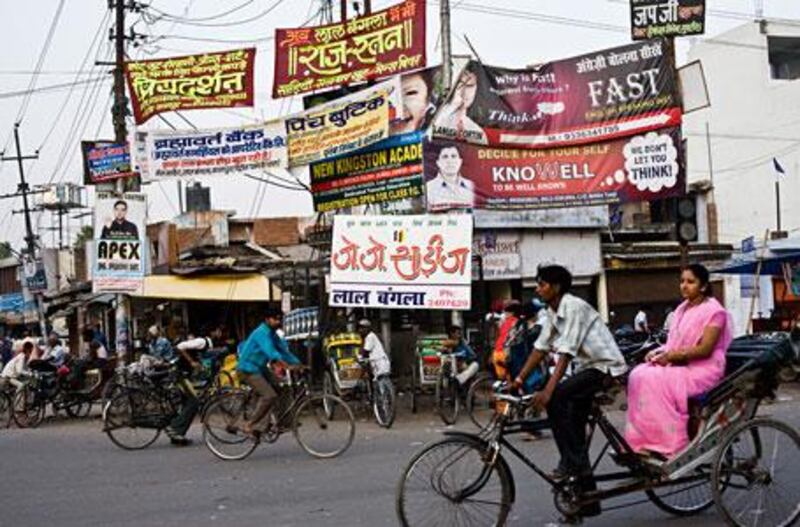 English language schools advertise at an intersection in Kanpur, Uttar Pradesh, where  learning English has become the key to upward mobility.