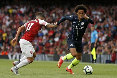 Manchester City's German midfielder Leroy Sane (R) vies with Arsenal's Uruguayan midfielder Lucas Torreira during the English Premier League football match between Arsenal and Manchester City at the Emirates Stadium in London on August 12, 2018. (Photo by Ian KINGTON / IKIMAGES / AFP) / RESTRICTED TO EDITORIAL USE. No use with unauthorized audio, video, data, fixture lists, club/league logos or 'live' services. Online in-match use limited to 45 images, no video emulation. No use in betting, games or single club/league/player publications. / 