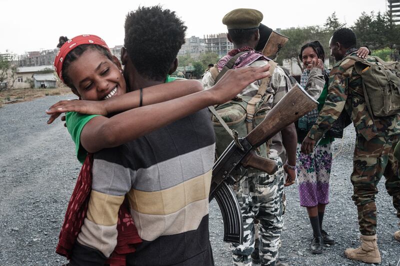 Women welcome Tigray People's Liberation Front fighters as they return to Mekele after seizing control of the city in June 2021.