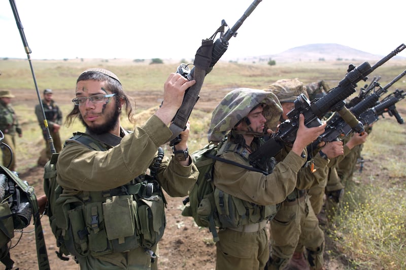 Israeli soldiers of the Ultra-Orthodox battalion "Netzah Yehuda" take part in their annual unit training in the Israeli annexed Golan Heights, near the Syrian border. AFP
