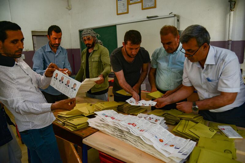 Election officials count ballots in Diyarbakir after polls closed in Turkey's presidential and parliamentary elections. AFP