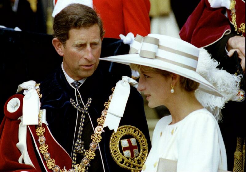 Prince Charles looks towards Princess Diana as they await their carriage to depart the Order of the Garter ceremony at Windsor Castle, June 15, 1992