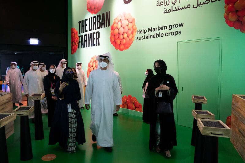 Sheikh Mohamed and Ms Al Hashimy view exhibits in the pavilion.