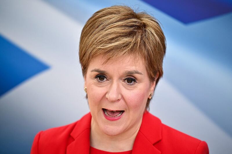 Scotland's First Minister and leader of the Scottish National Party (SNP) Nicola Sturgeon, launches the party's Election Manifesto in Glasgow on April 15, 2021, during campaigning for the Scottish Parliamentary elections. Scotland holds elections for its devolved parliament in Edinburgh on May 6 and the SNP hopes to use the results to push for a fresh poll on independence, after Scots voted overwhelmingly against the UK's Brexit divorce from the EU in 2016. / AFP / POOL / Jeff J Mitchell
