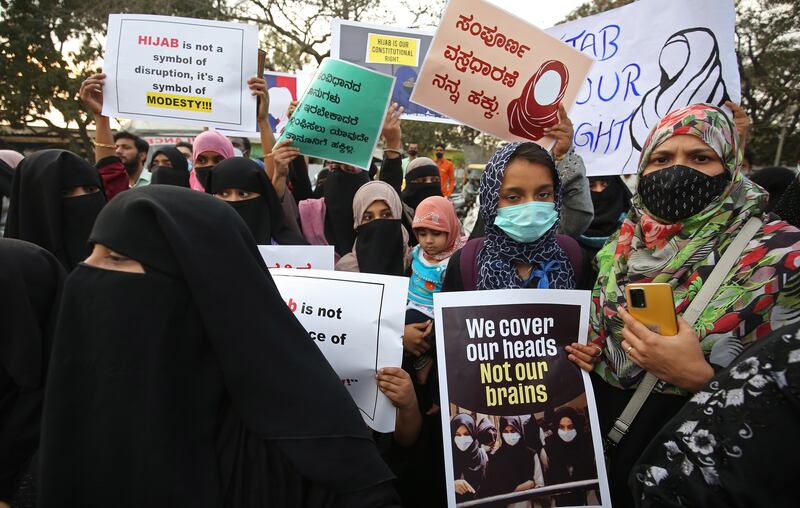 Muslim women wearing the hijab protest in Bangalore after students in the southern Indian state of Karnataka were barred from entering colleges wearing the traditional headscarves. EPA