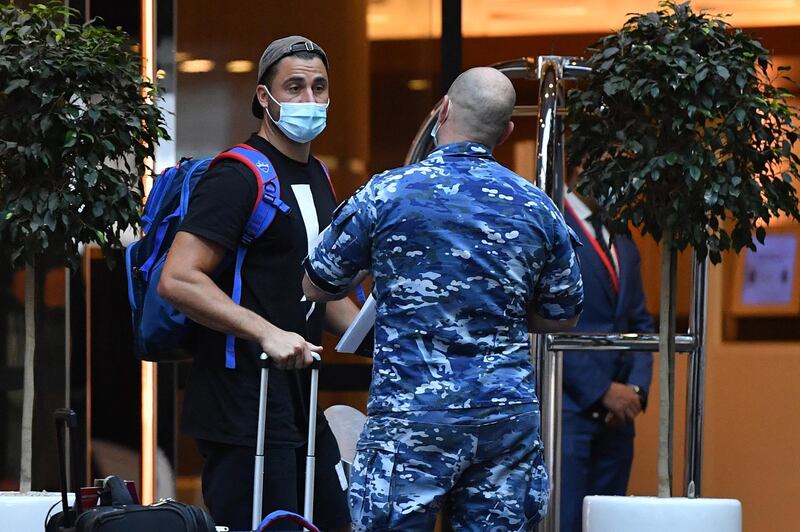 Australian all-rounder Marcus Stoinis arrives for hotel quarantine at the Marriott Hotel in Sydney. EPA