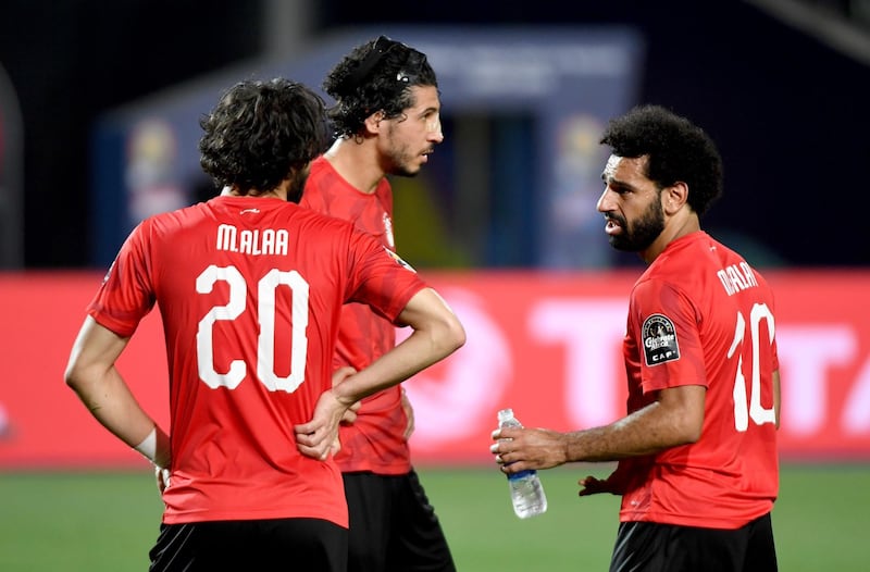 Egypt defender Ahmed Hegazi speaks with Mohamed Salah and defender Mahmoud Alaa. AFP
