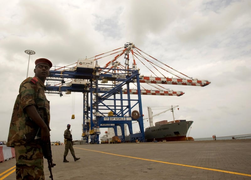 FILE PHOTO: A Djibouti policeman stands guard during the opening ceremony of Dubai-based port operator DP World's Doraleh container terminal in Djibouti port February 7, 2009. REUTERS/Ahmed Jadallah/File Photo