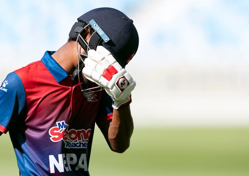 Nepal's Rohit Paudel looks despondent after being dismissed by UAE's Zahoor Khan.