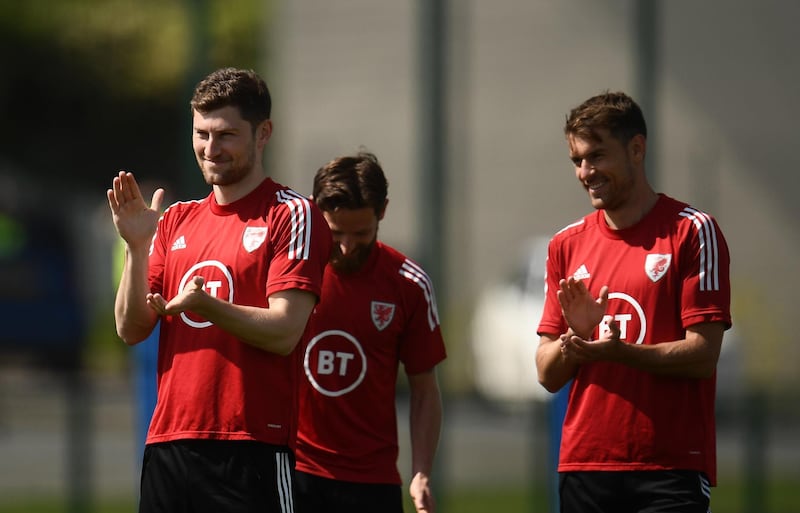 Ben Davies and Aaron Ramsey. Getty