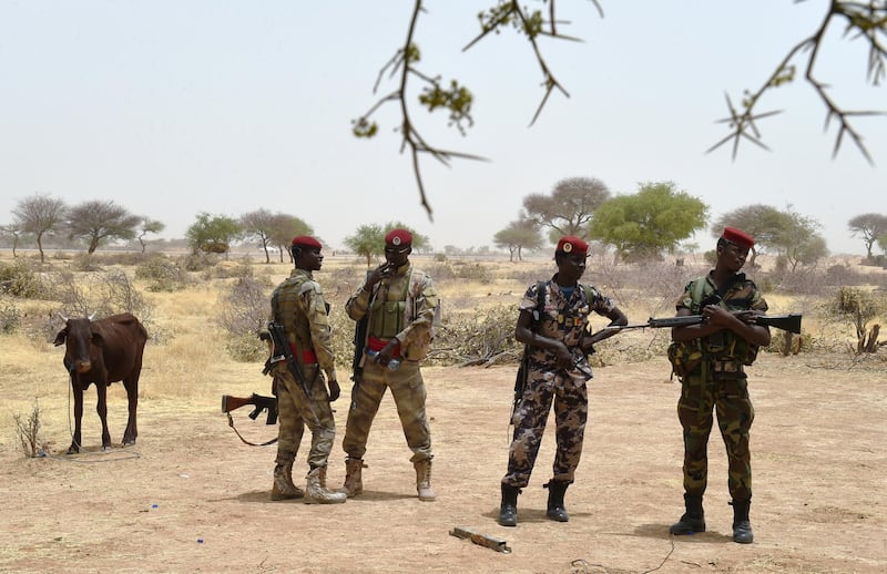 Chadian soldiers wait near the airport of Diffa, southeastern Niger, on April 3, 2015, near the Nigerian town of Malam Fatori which was retaken from Boko Haram by troops from Chad and Niger. AFP PHOTO / PHILIPPE DESMAZES / AFP PHOTO / PHILIPPE DESMAZES