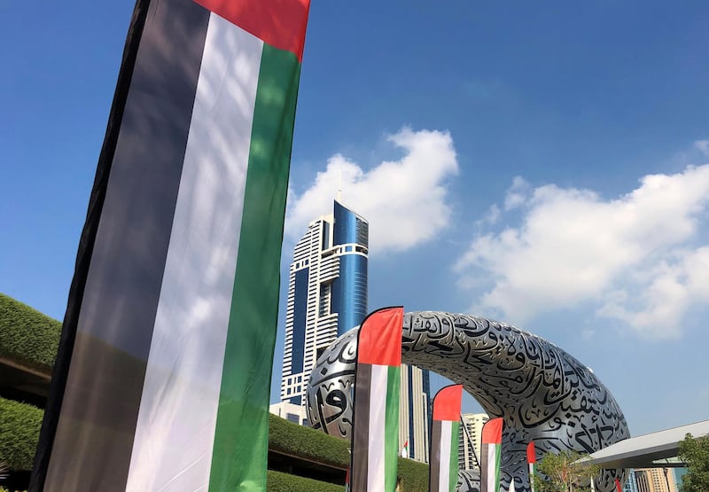 Dubai, United Arab Emirates - November 30, 2020: National Day. UAE flags outside the Museum of the Future. Monday, November 30th, 2020 in Dubai. Chris Whiteoak / The National