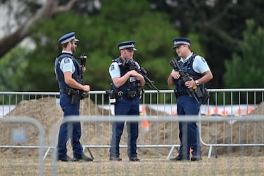 Armed police officers patrol gravesites for victims in Christchurch early on March 18, 2019, three days after a shooting incident killed at least fifty people in mosques in the city. AFP