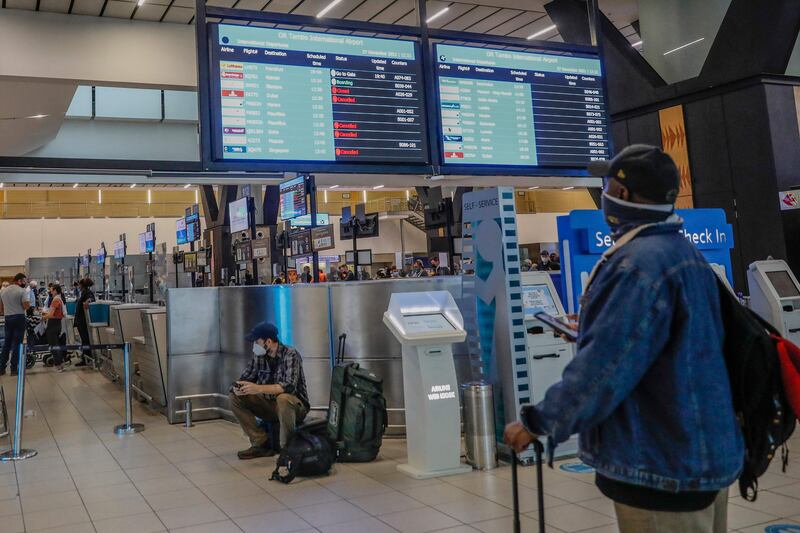 Noticeboards display cancelled flights at OR Tambo International Airport in Johannesburg. AFP