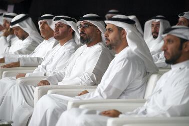 Sheikh Khalid bin Mohamed bin Zayed, Deputy National Security Adviser, centre, attends Abu Dhabi's Ghadan 21 initiative with Dr Ahmed Al Mazrouei, Secretary General of the Abu Dhabi Executive Council left,, and Sheikh Theyab bin Mohamed bin Zayed, Chairman of the Department of Transport, right. Hamad Al Kaabi / Ministry of Presidential Affairs