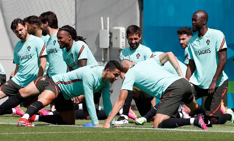 Portugal players stretch during a training session at Illovszky Rudolf Stadium. Reuters