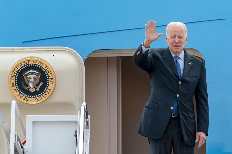 US President Joe Biden waves as he boards Air Force One to head to Brussels on Wednesday. AP