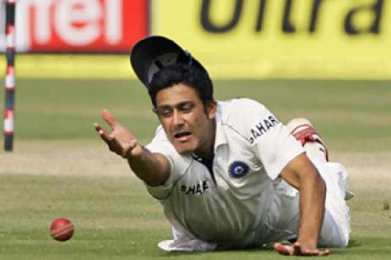 The India captain Anil Kumble fields a ball on the third day of the third Test against Australia.