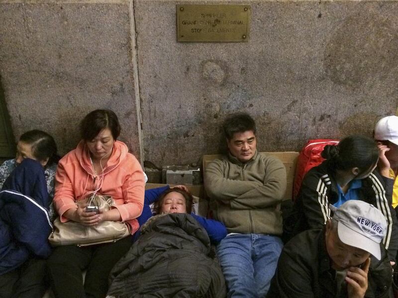 Customers wait in line on the first day of sale for the iPhone 6 and iPhone 6 Plus outside the Apple store at Grand Central Terminal in New York. Adrees Latif / Reuters