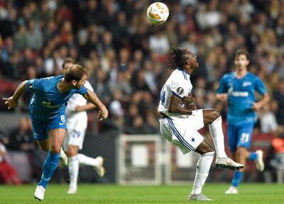 Zenit St. Petersburg's Branislav Ivanovic, left, and FC Copenhagen's Dame N'Doye battle for the ball during the Europa League Group C soccer match at Parken Stadium in Copenhagen, Denmark, Thursday Sept. 20, 2018. (Liselotte Sabroe/Ritzau Scanpix via AP)