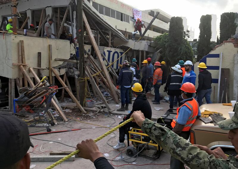 Rescue workers search in the rubble for students of the Enrique Rebsamen school after an earthquake hit Mexico City. Michael O'Boyle / Reuters