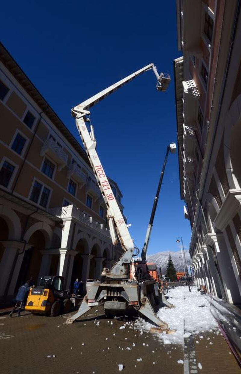 Workmen continue construction at accommodation in Gorki Village Krasnaya Polyana prior to the Sochi 2014 Winter Olympics on Sunday.  Lars Baron / Getty Images