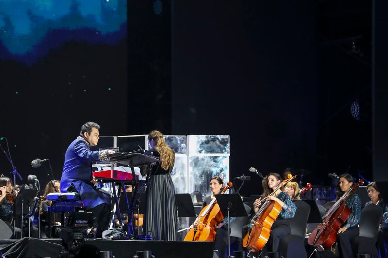 The Firdaus Orchestra, an all-women musical ensemble led by Academy and Grammy Award-winning composer AR Rahman, performs on the Jubilee Stage at Expo 2020 Dubai with a tribute to space explorers. Khushnum Bhandari/ The National