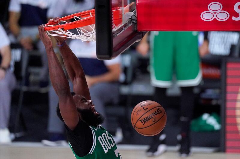 Boston Celtics' Jaylen Brown, celebrates dunking against the Miami Heat during the second half of an NBA conference final playoff basketball game, in Lake Buena Vista, US. AP Photo