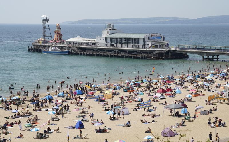 Crowds hit the beach in Bournemouth. PA