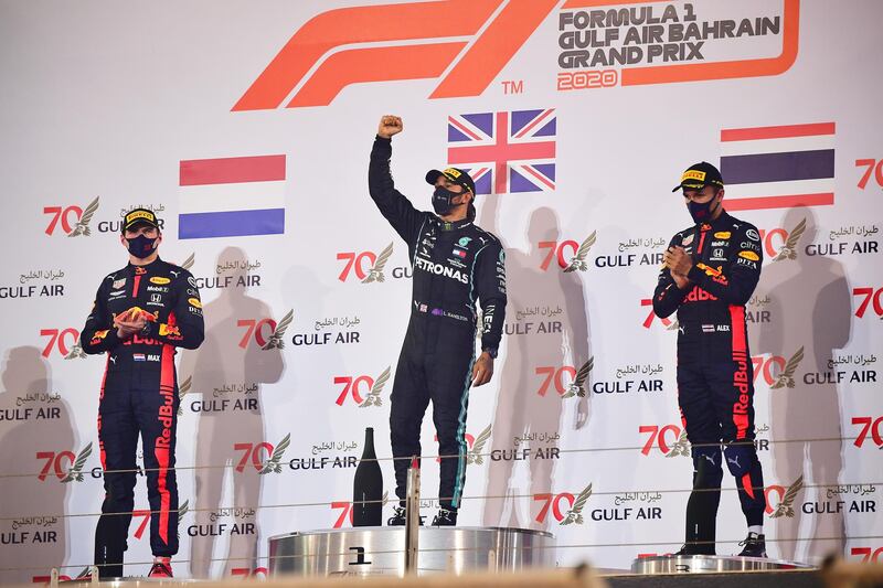 Race winner Lewis Hamilton, centre, with second placed Max Verstappen, right, and Alexander Albon  who finished third on the podium. Getty