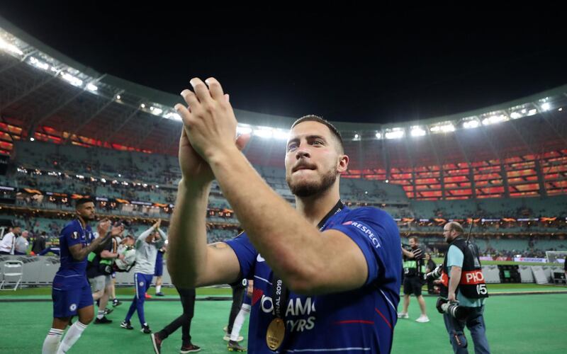 Hazard celebrates with fans at the final whistle. PA Photo