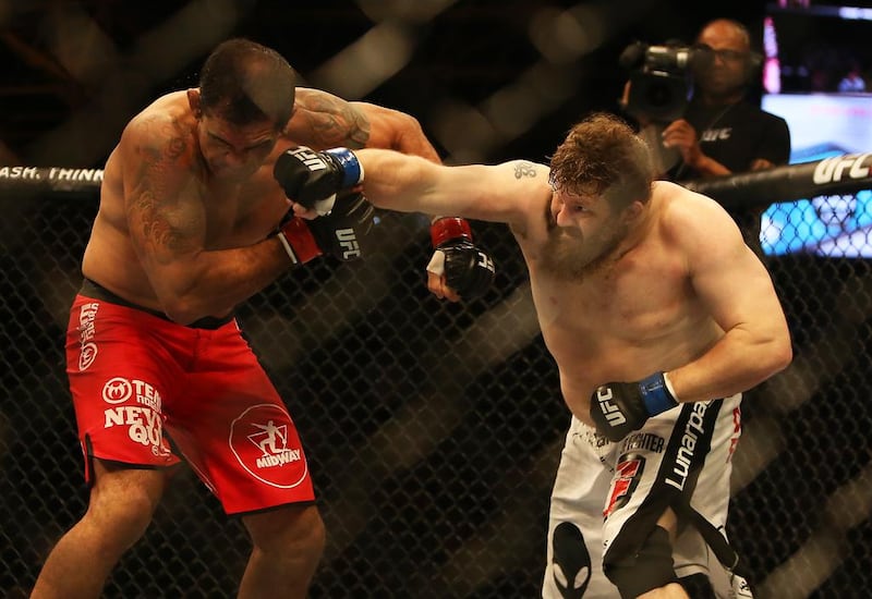 Roy Nelson, right, lands his knockout punch on Antonio Nogueira on Saturday night. Pawan Singh / The National / 2014